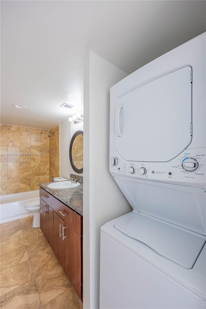 4164 Inverrary Drive, Unit 812 Lauderhill, FL 33319 - Photo 18 of 21 a view of kitchen with washer and dryer
