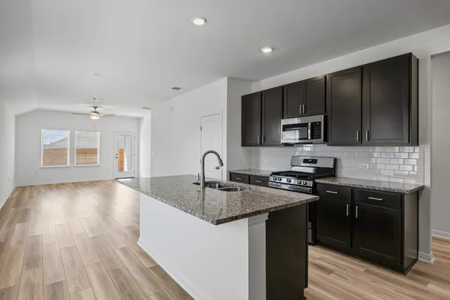 a backyard of a house with lots of green space