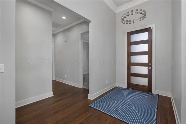 an empty room with wooden floor and closet