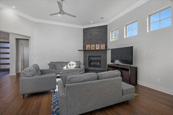 a living room with furniture and a fireplace