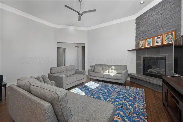 a living room with furniture and a fireplace