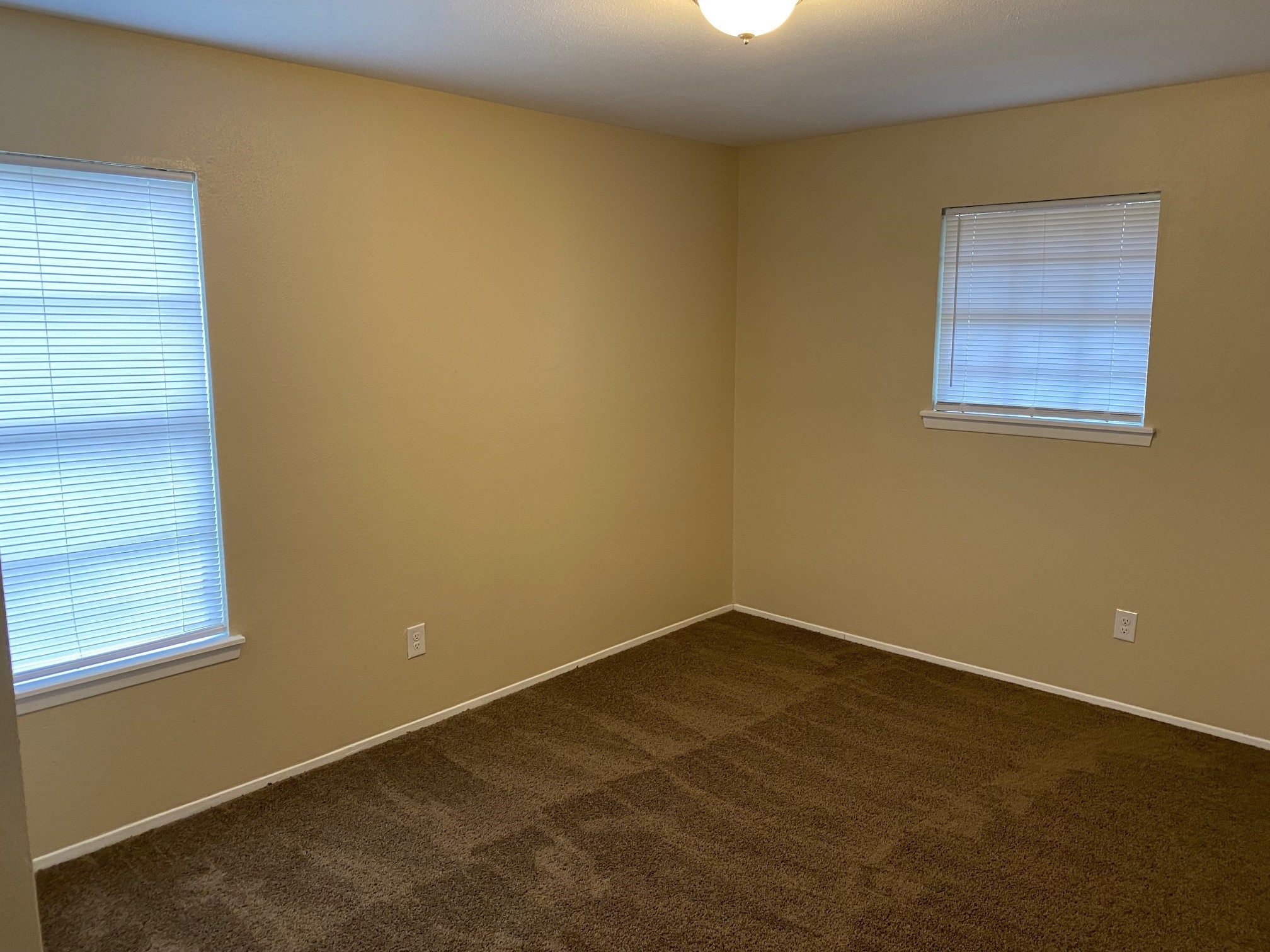 112 County Road 921 Angleton, TX 77515 - Photo 12 of 13 an empty room with a window