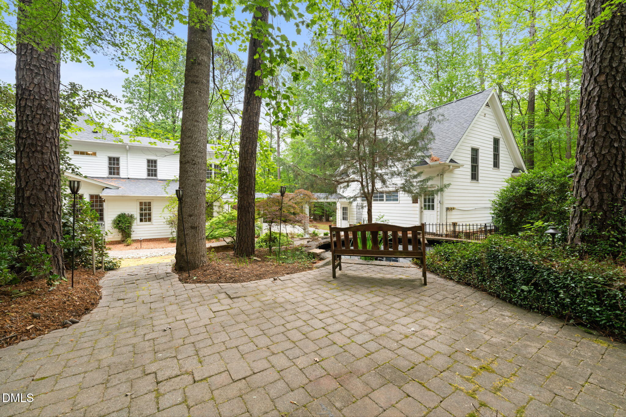 5809 Stone Spring Road Raleigh, NC 27613 - Photo 47 of 54 a wooden bench sitting in front of a building
