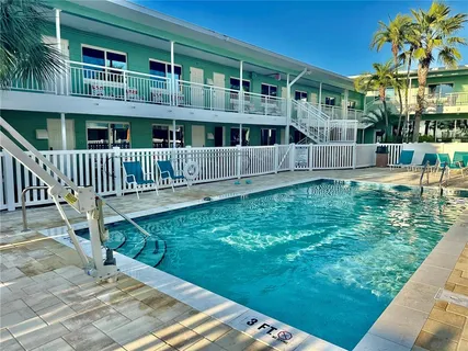 a view of house with a yard