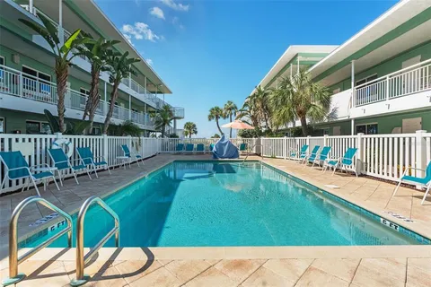 a view of swimming pool with a patio