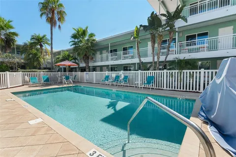 a balcony with view of swimming pool