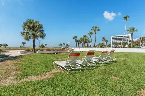 a view of a house with a backyard porch and sitting area