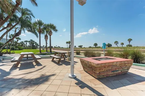 a view of a swimming pool and lounge chairs