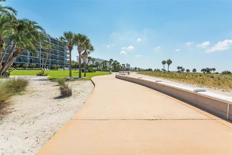 a view of a swimming pool and a yard