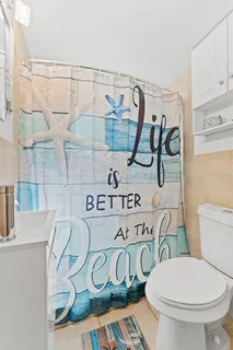 a bathroom with a toilet and a sink
