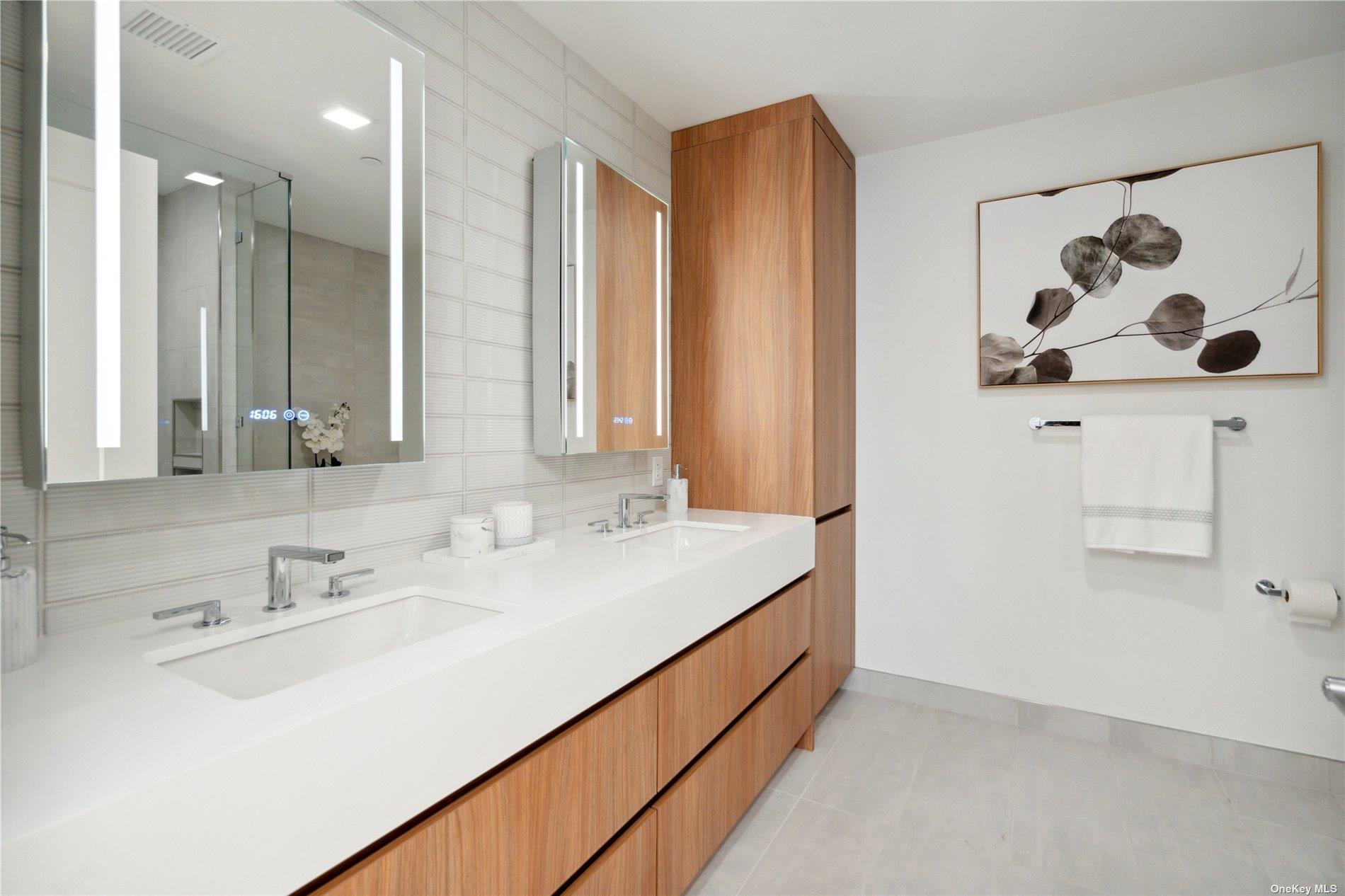 218 Middle Neck Road, Unit 111 Great Neck, NY 11021 - Photo 17 of 29 a bathroom with a sink and a mirror