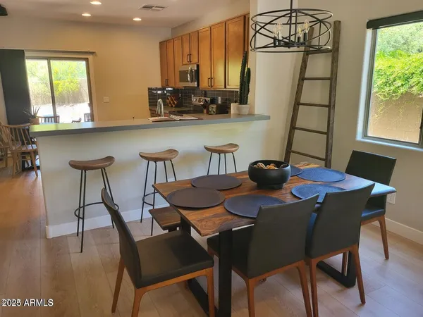 a view of a dining room with furniture window and outside view