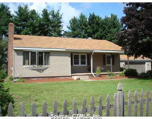 360 Strong Road South Windsor, CT 06074 - Photo 1 of 1 a front view of house with a garden and patio