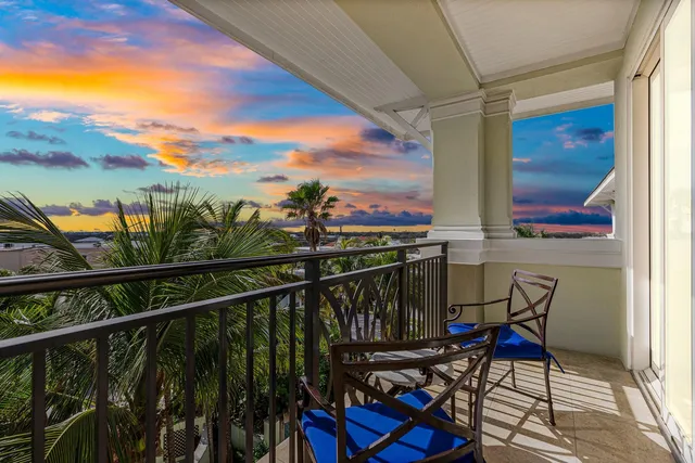 a front view of a multi story building with yard