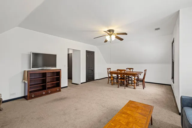 a view of a livingroom with furniture and a chandelier