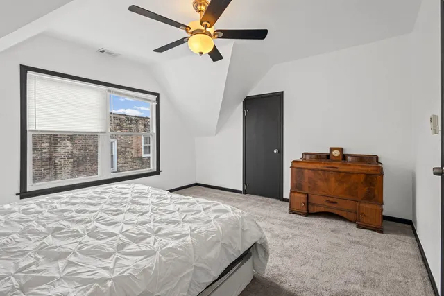 a bedroom with a bed and a cabinets