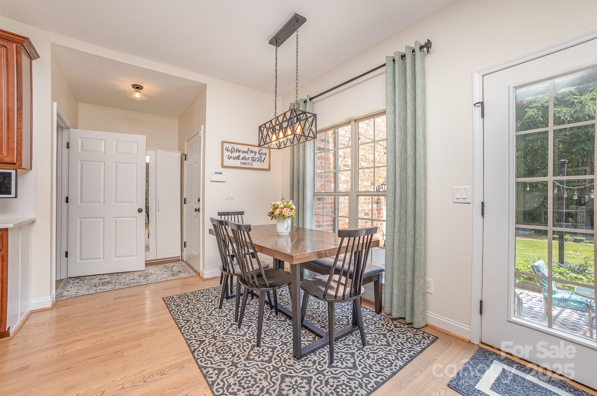 8121 Cane Pointe Lane Waxhaw, NC 28173 - Photo 13 of 39 a view of a dining room with furniture and window