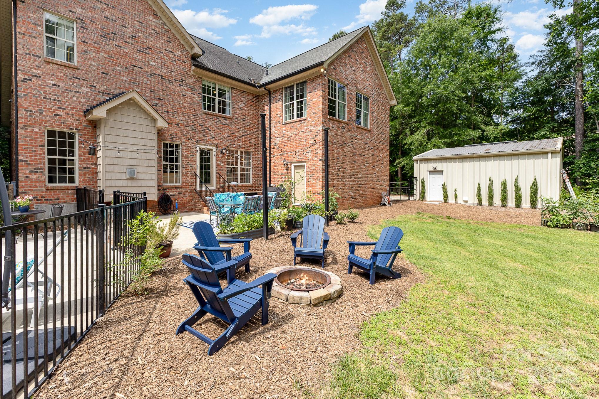 8121 Cane Pointe Lane Waxhaw, NC 28173 - Photo 31 of 39 a view of a patio with couple of chairs