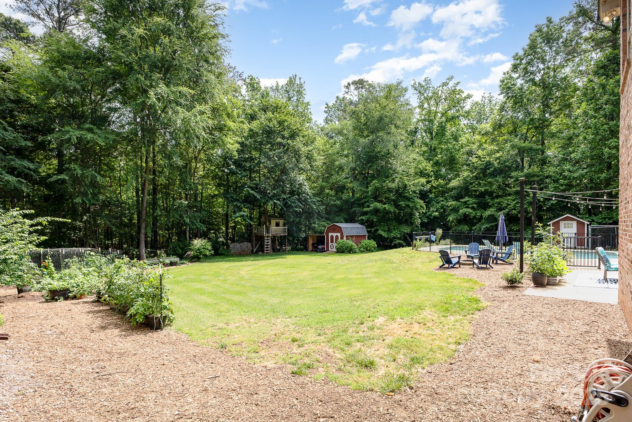 8121 Cane Pointe Lane Waxhaw, NC 28173 - Photo 33 of 39 a view of a swimming pool with a sitting area