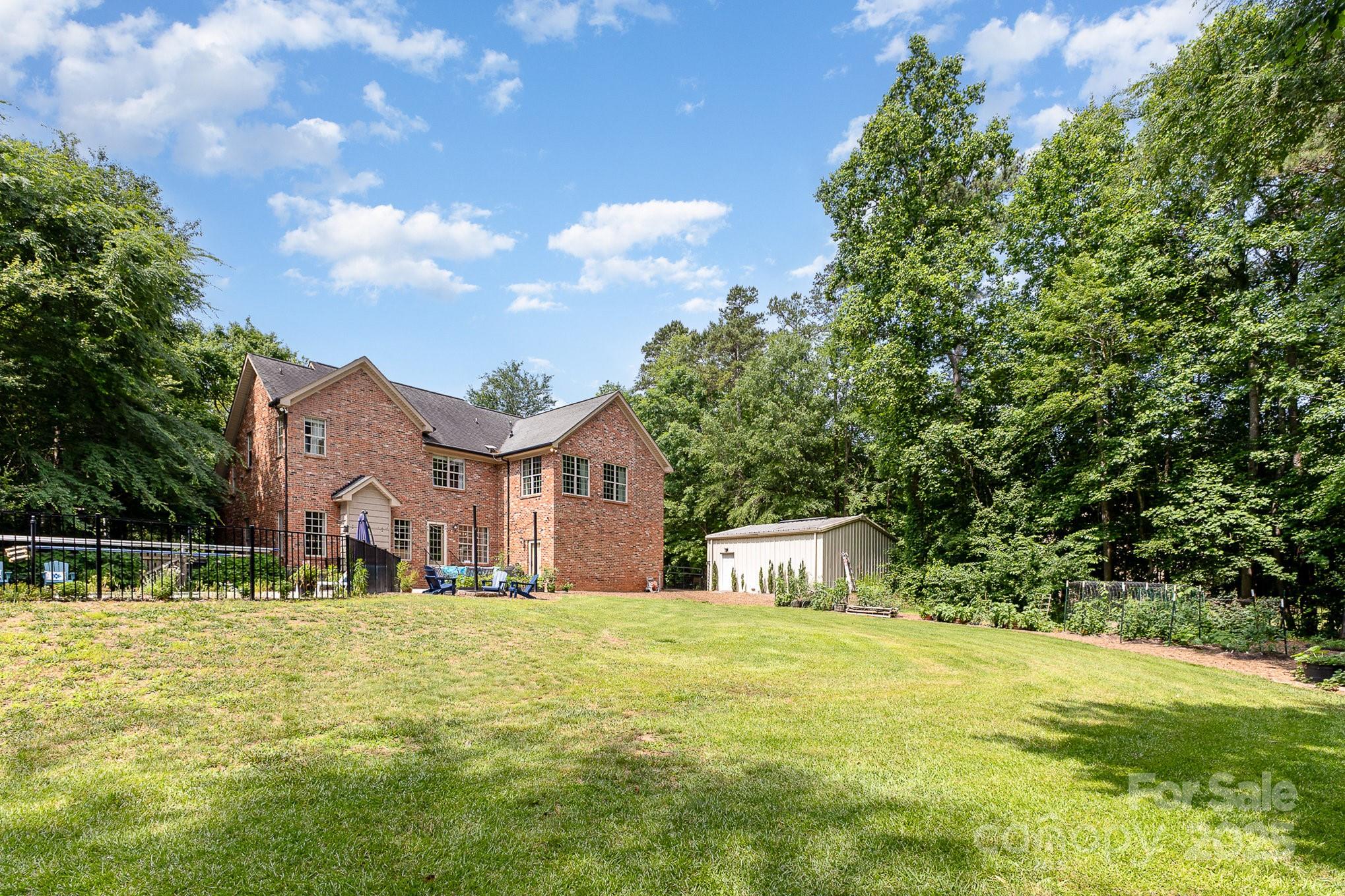 8121 Cane Pointe Lane Waxhaw, NC 28173 - Photo 36 of 39 a front view of a house with a yard