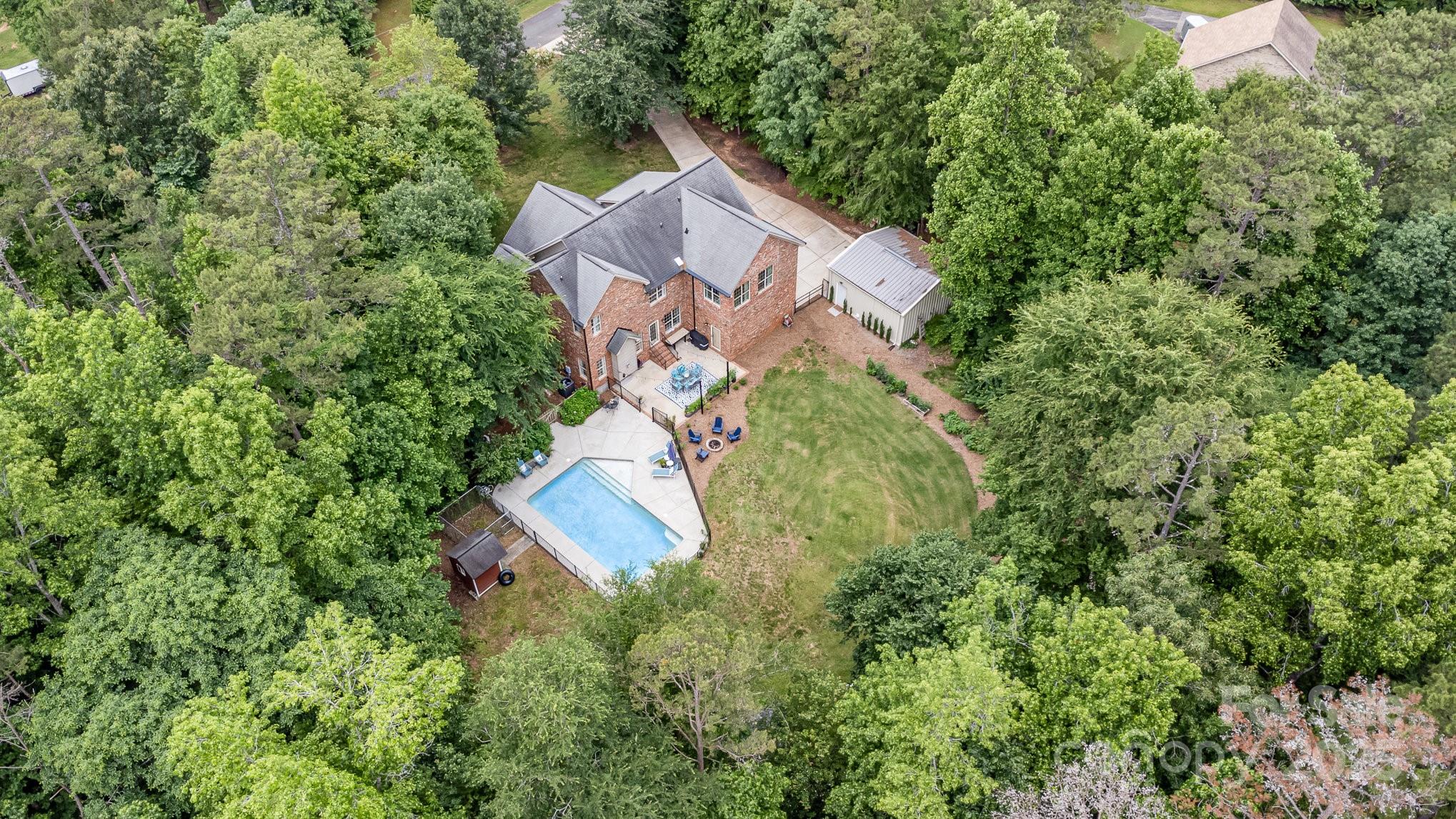 8121 Cane Pointe Lane Waxhaw, NC 28173 - Photo 38 of 39 an aerial view of a house with a yard and trees