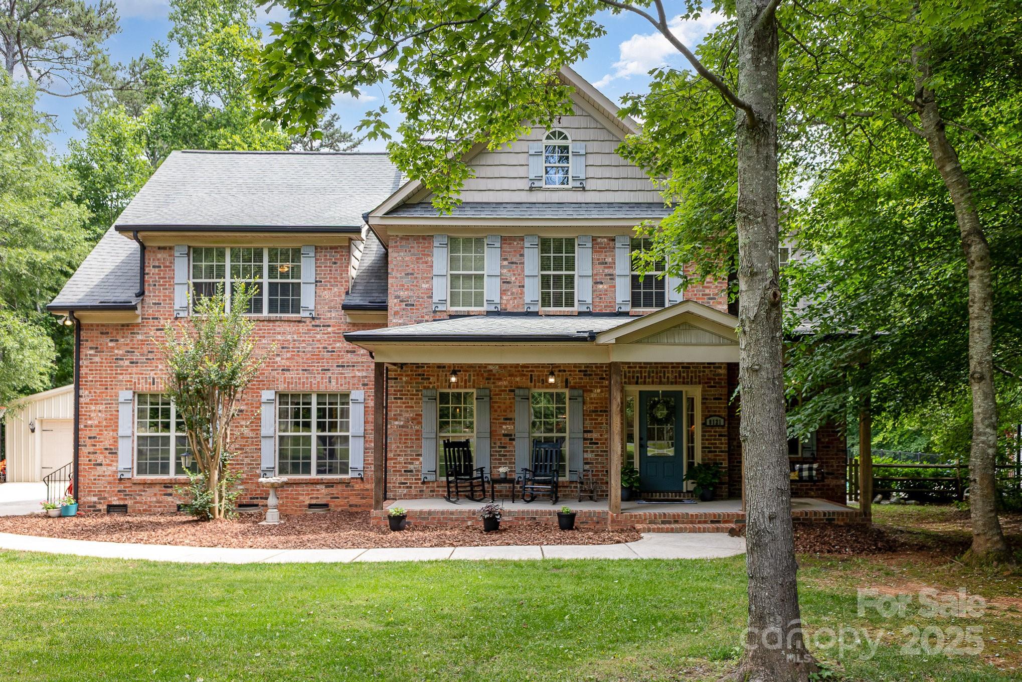 8121 Cane Pointe Lane Waxhaw, NC 28173 - Photo 4 of 39 front view of a house with a yard