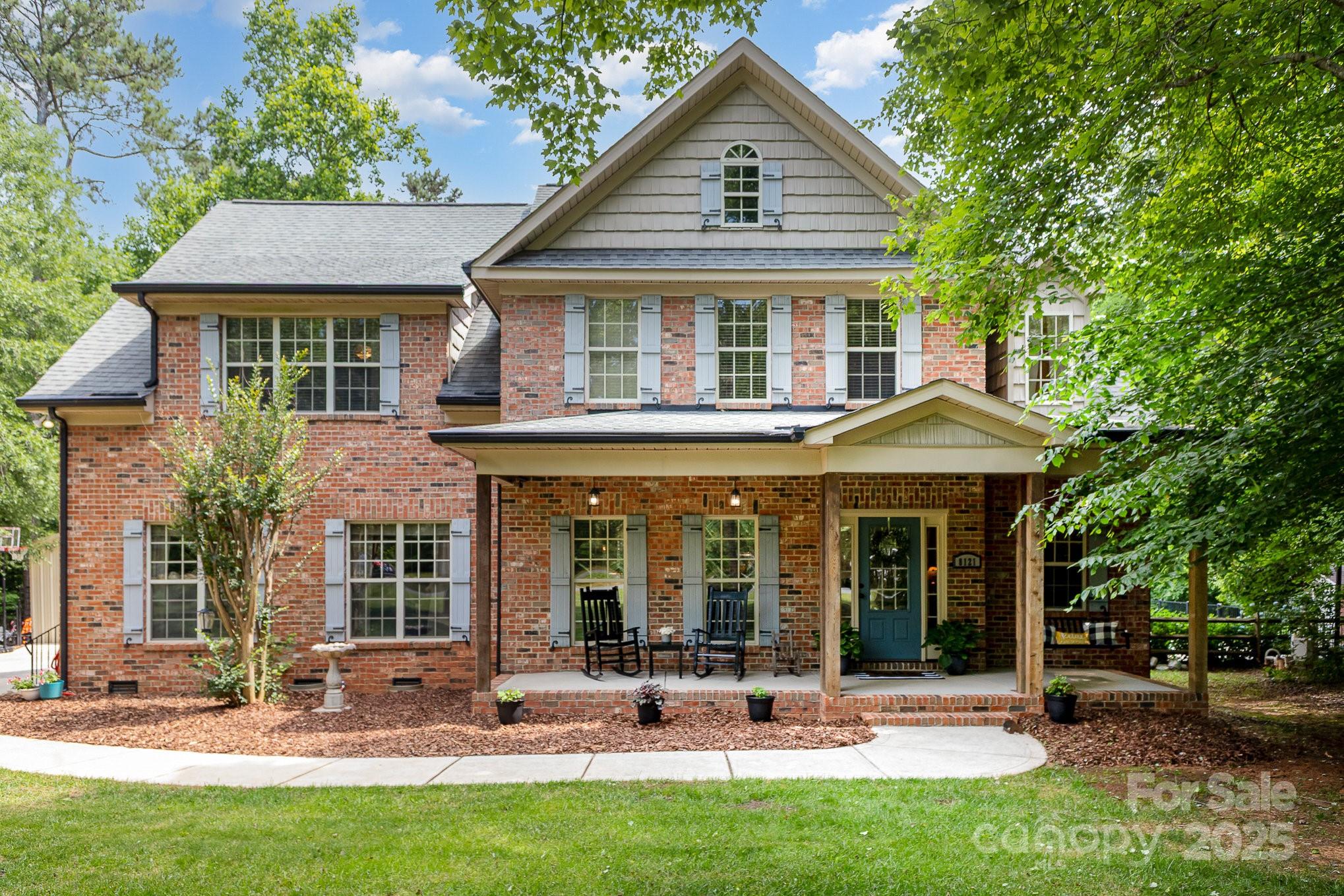 8121 Cane Pointe Lane Waxhaw, NC 28173 - Photo 7 of 39 front view of a house with a yard