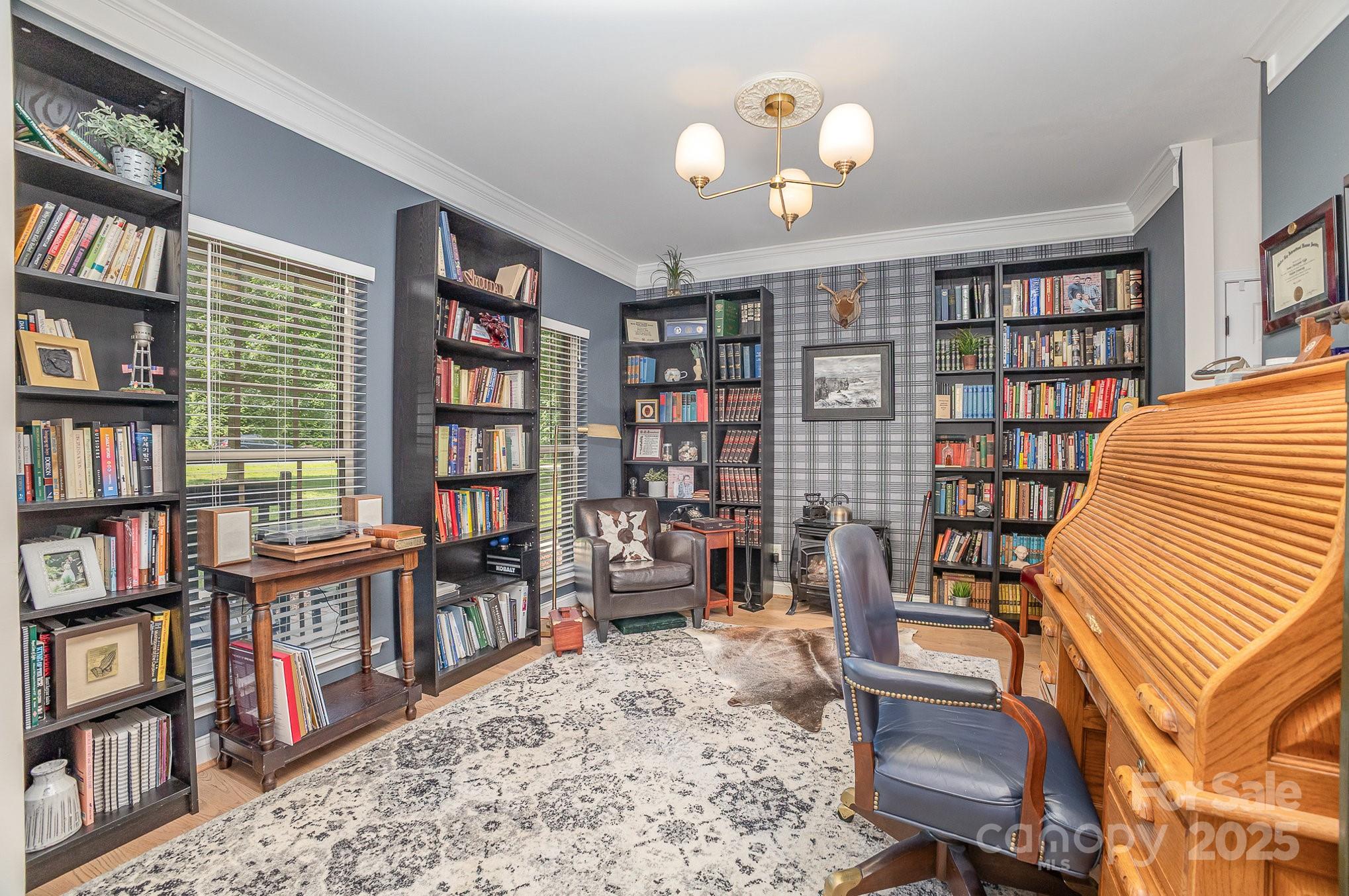 8121 Cane Pointe Lane Waxhaw, NC 28173 - Photo 9 of 39 a view of a livingroom with furniture and bookshelf