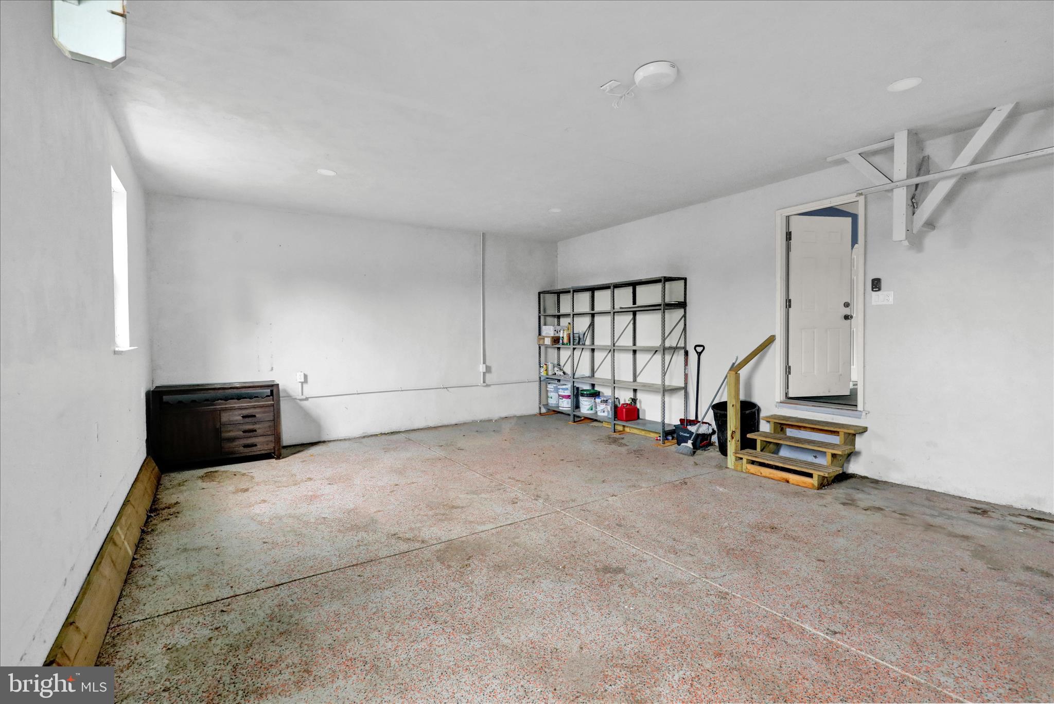 434 East Moyer Road Pottstown, PA 19464 - Photo 32 of 38 a view of a livingroom with a staircase and a flat screen tv
