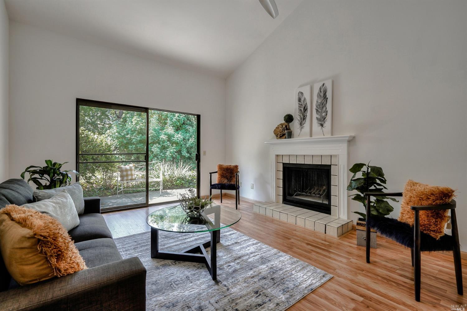 336 Los Alamos Road Santa Rosa, CA 95409 - Photo 1 of 1 a living room with furniture and a fireplace