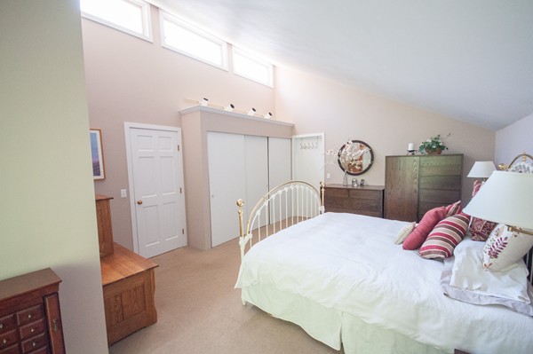 27 Draper Road Wayland, MA 01778 - Photo 11 of 21 a bedroom with a bed and cabinets