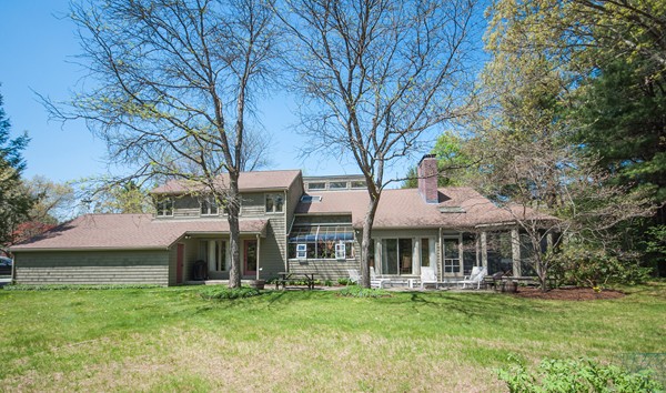 27 Draper Road Wayland, MA 01778 - Photo 19 of 21 a front view of a house with a garden