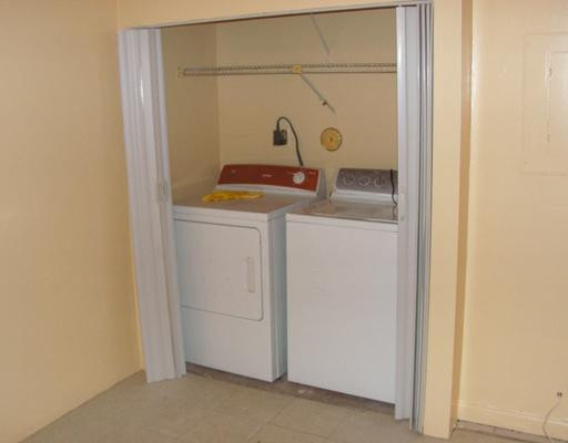 5296 Gate Lake Road, Unit 5296 Tamarac, FL 33319 - Photo 14 of 16 a utility room with dryer and washer