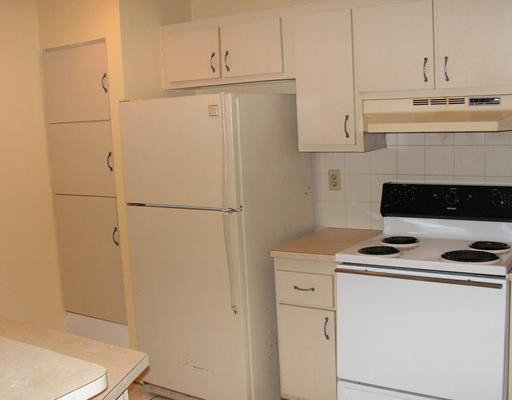 5296 Gate Lake Road, Unit 5296 Tamarac, FL 33319 - Photo 3 of 16 a kitchen with a refrigerator and a stove