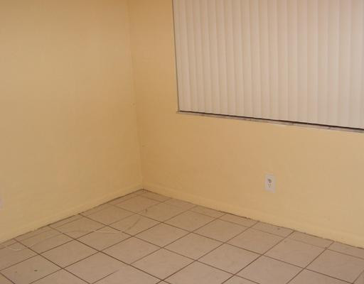 5296 Gate Lake Road, Unit 5296 Tamarac, FL 33319 - Photo 8 of 16 a view of white wall and cabinet
