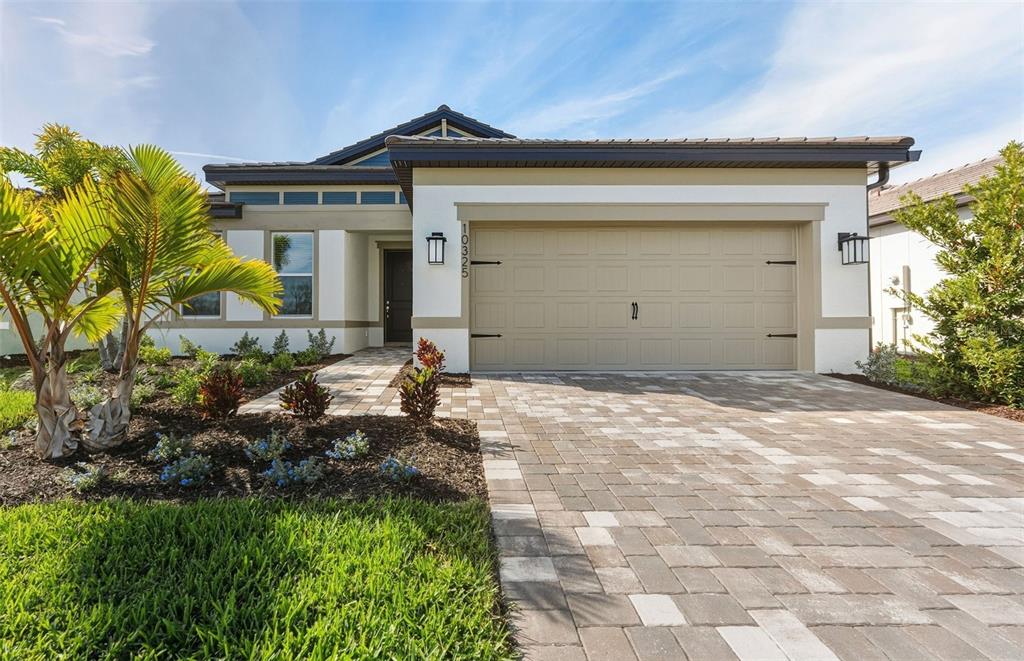 10325 Spruce River Way Parrish, FL 34219 - Photo 1 of 1 a front view of a house with a yard