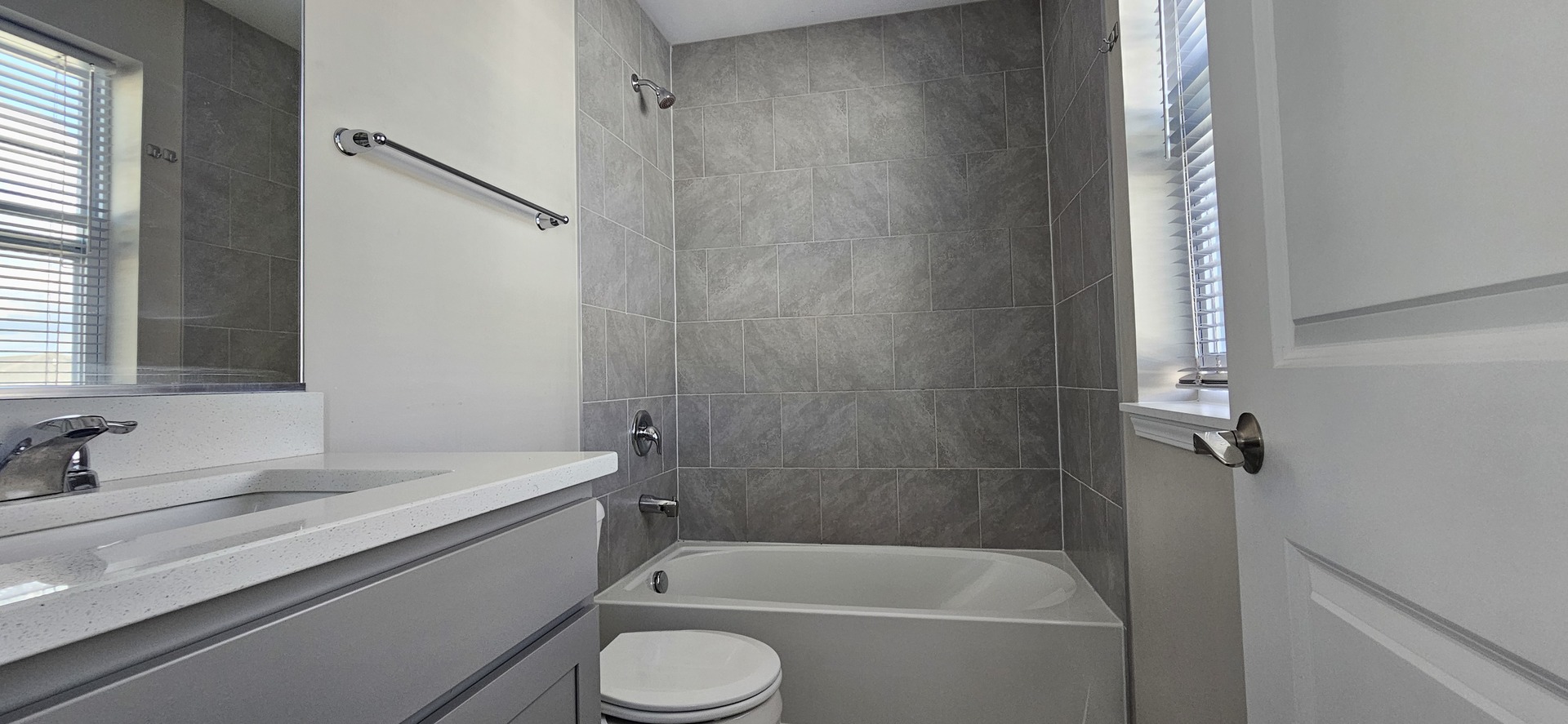 210 Timberleaf Circle Roselle, IL 60172 - Photo 7 of 14 a bathroom with a granite countertop bathtub shower sink vanity and toilet