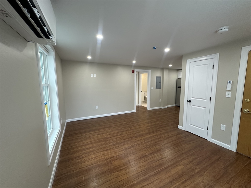 64 Holten Street, Unit 105 Danvers, MA 01923 - Photo 13 of 13 a view of hallway with wooden floor