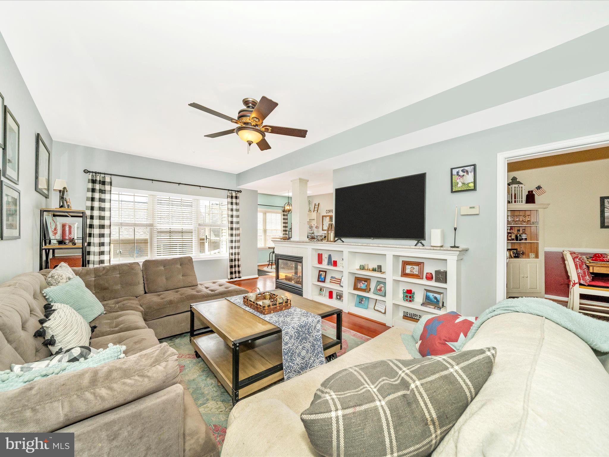 2529 Waterside Drive Frederick, MD 21701 - Photo 12 of 68 a living room with furniture and a flat screen tv