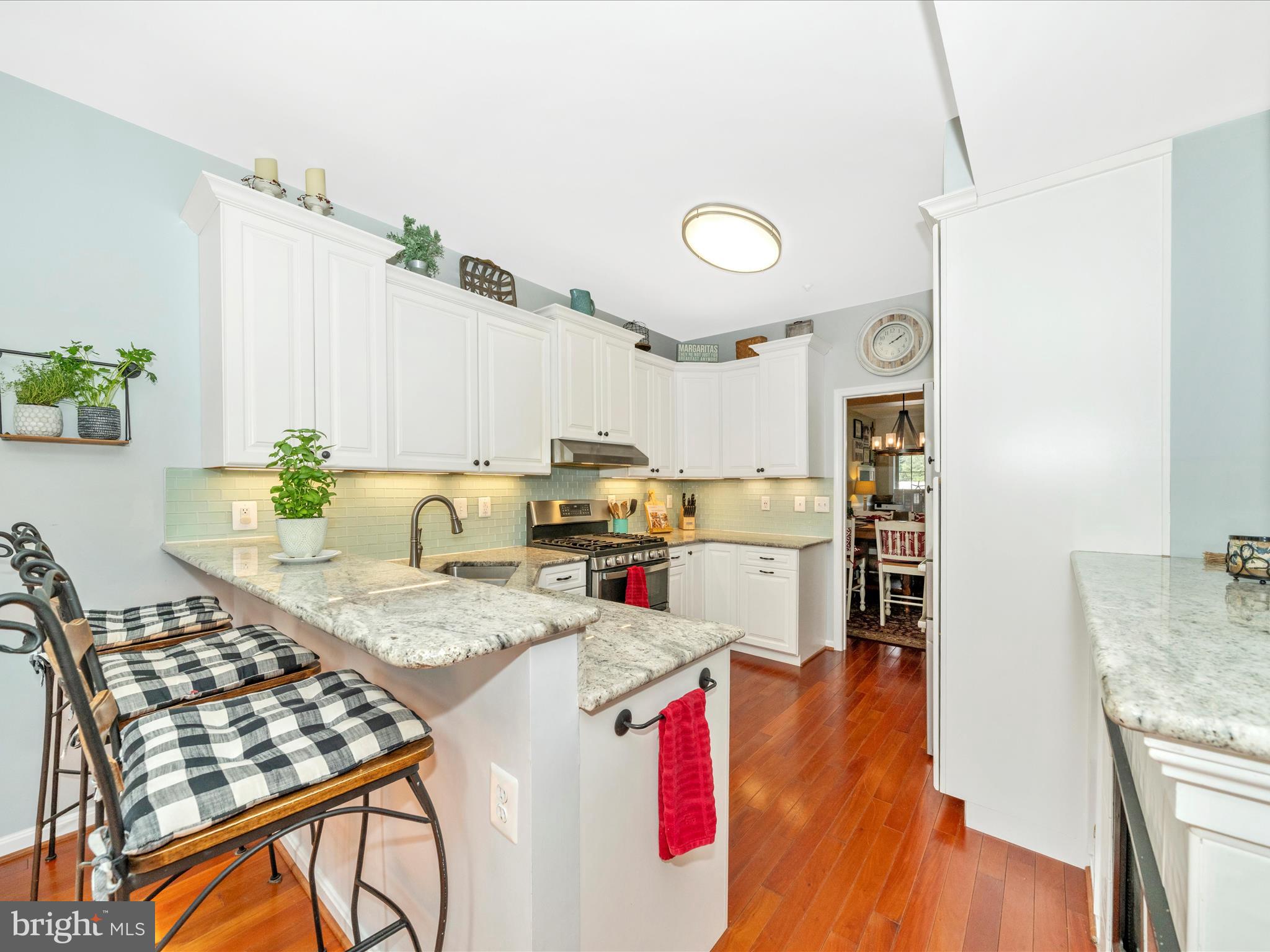 2529 Waterside Drive Frederick, MD 21701 - Photo 13 of 68 a open kitchen with stainless steel appliances granite countertop a stove and a refrigerator