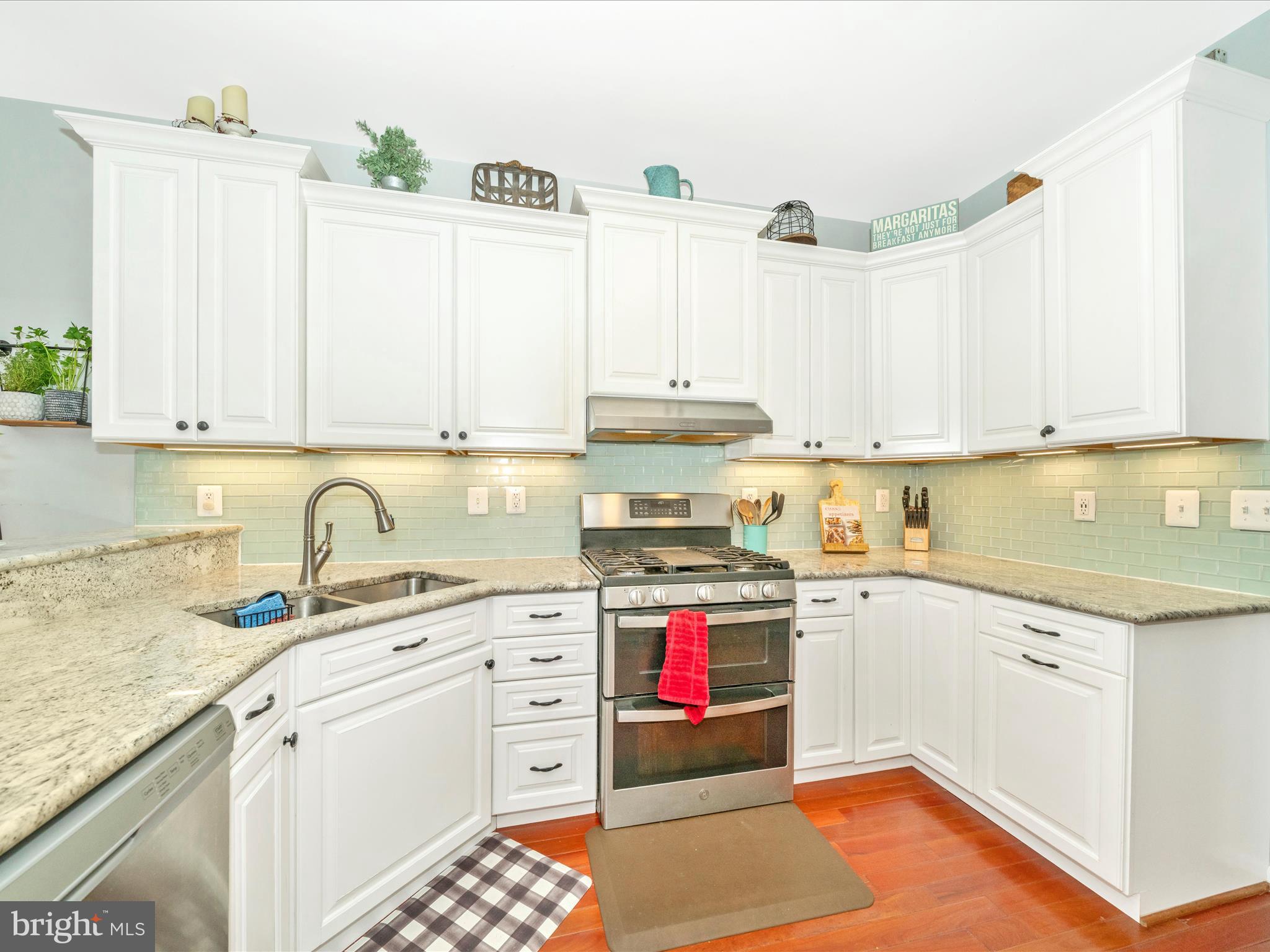 2529 Waterside Drive Frederick, MD 21701 - Photo 15 of 68 a kitchen with stainless steel appliances granite countertop a sink stove and cabinets