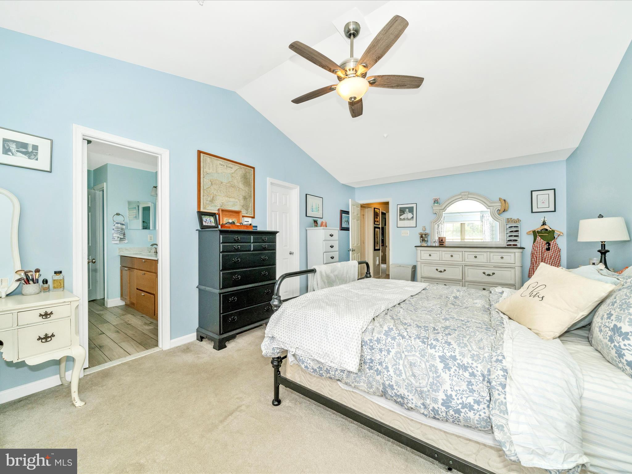 2529 Waterside Drive Frederick, MD 21701 - Photo 26 of 68 a bedroom with a large bed and a chandelier