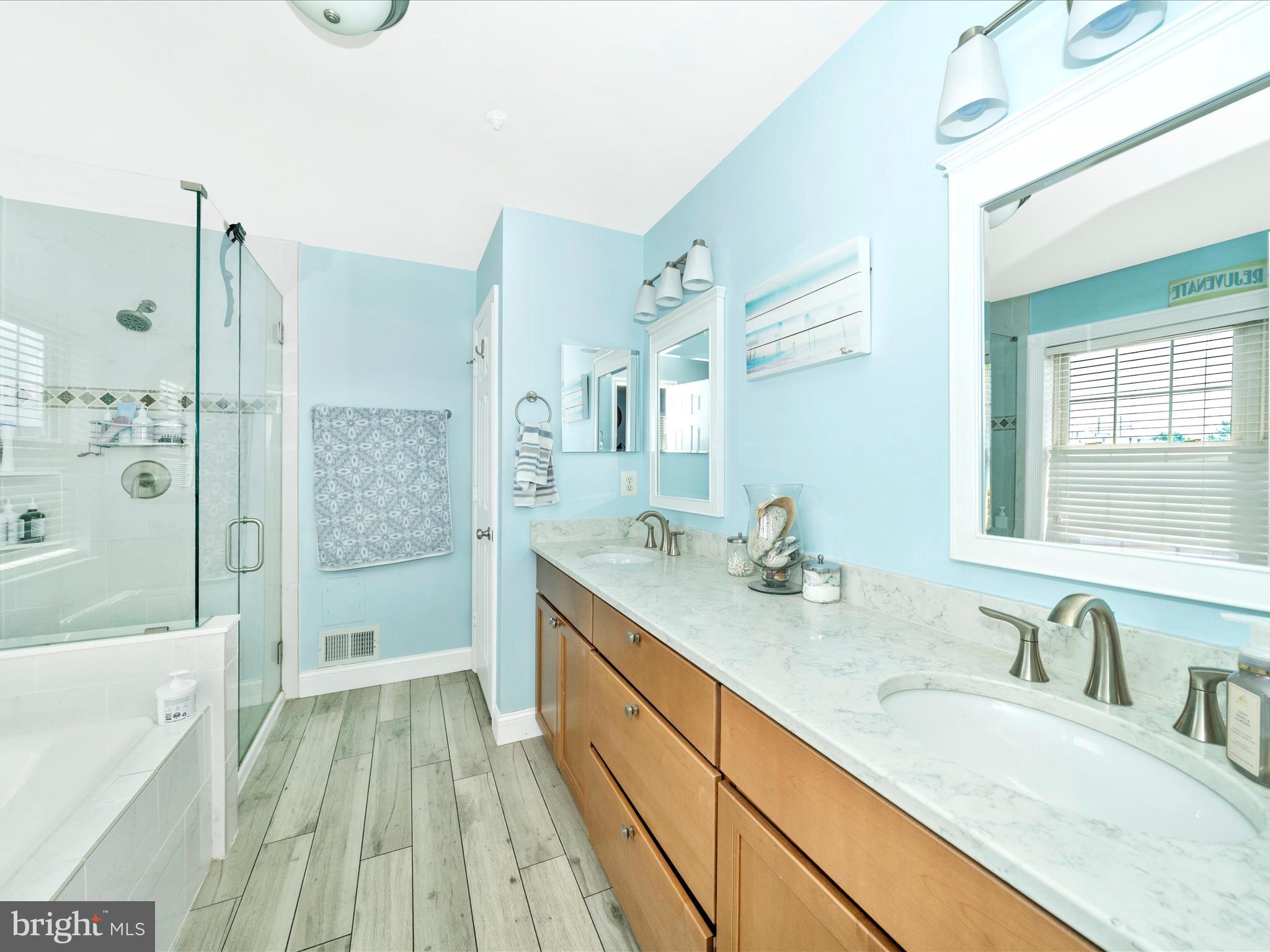 2529 Waterside Drive Frederick, MD 21701 - Photo 27 of 68 a bathroom with a granite countertop sink mirror toilet shower and bathtub