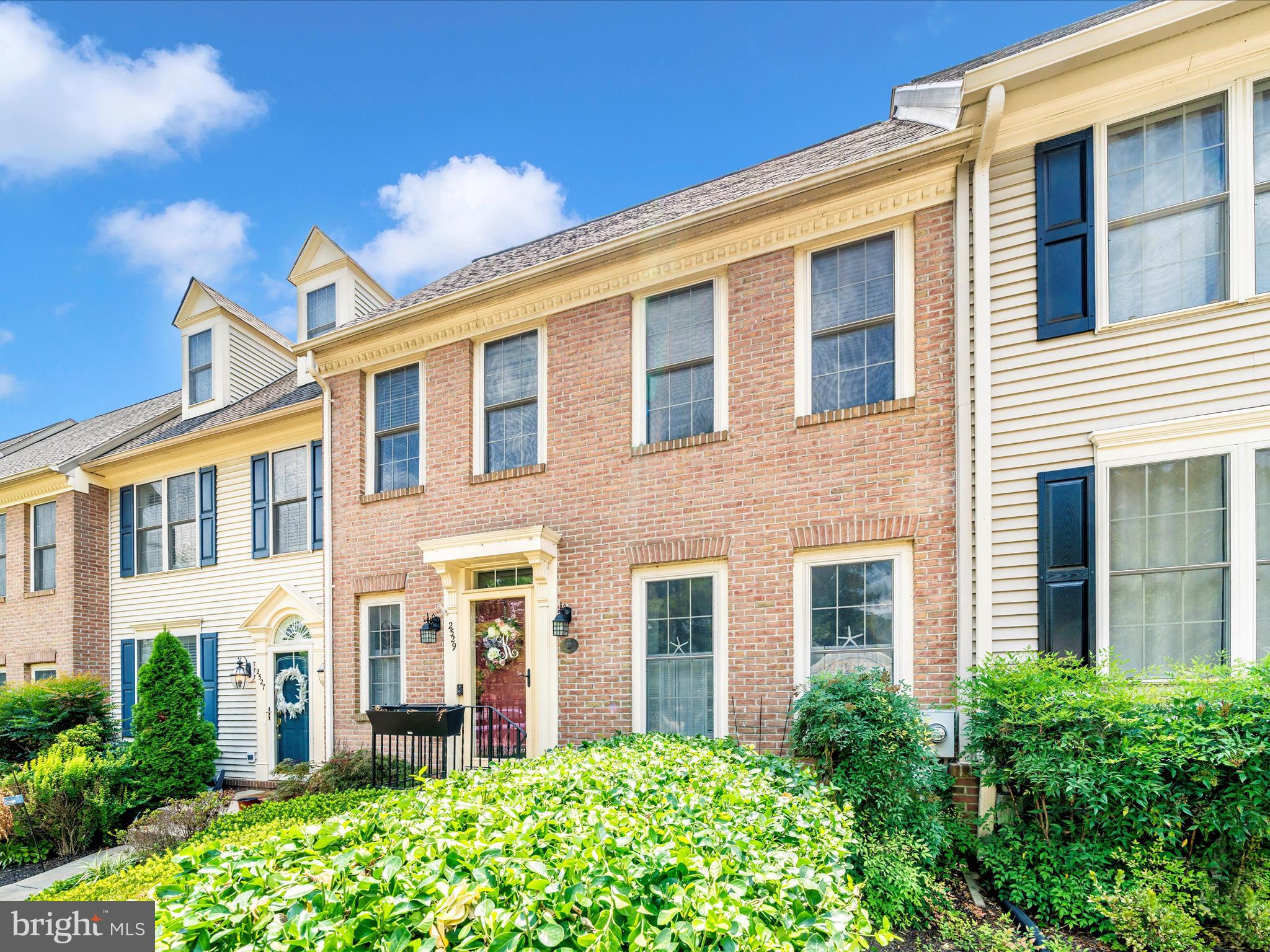 2529 Waterside Drive Frederick, MD 21701 - Photo 50 of 68 a view of a brick building next to a yard