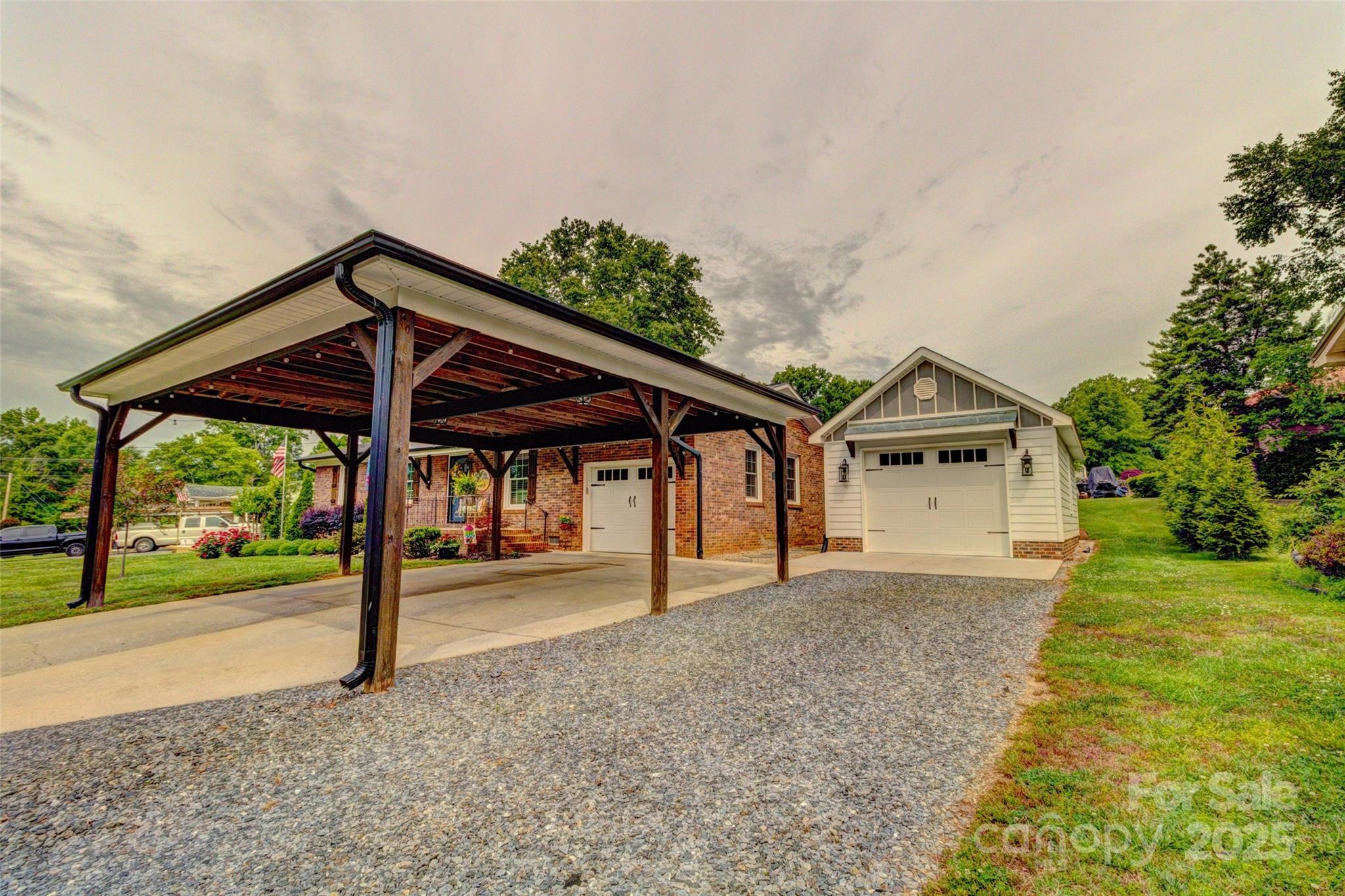 800 Sunset Road Cherryville, NC 28021 - Photo 16 of 20 a view of a house with a yard and garage