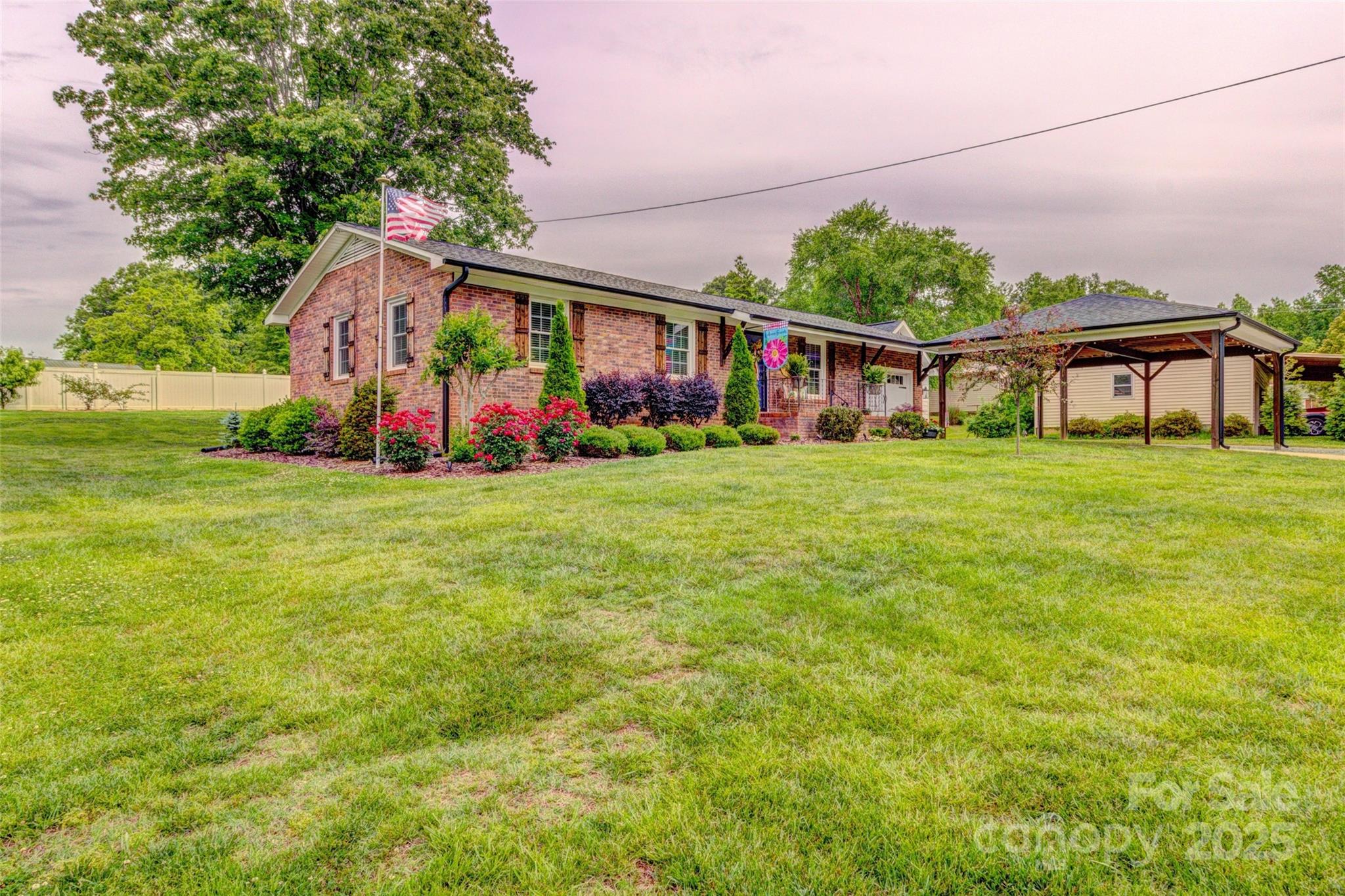 800 Sunset Road Cherryville, NC 28021 - Photo 2 of 20 a front view of house with yard and trees in the background
