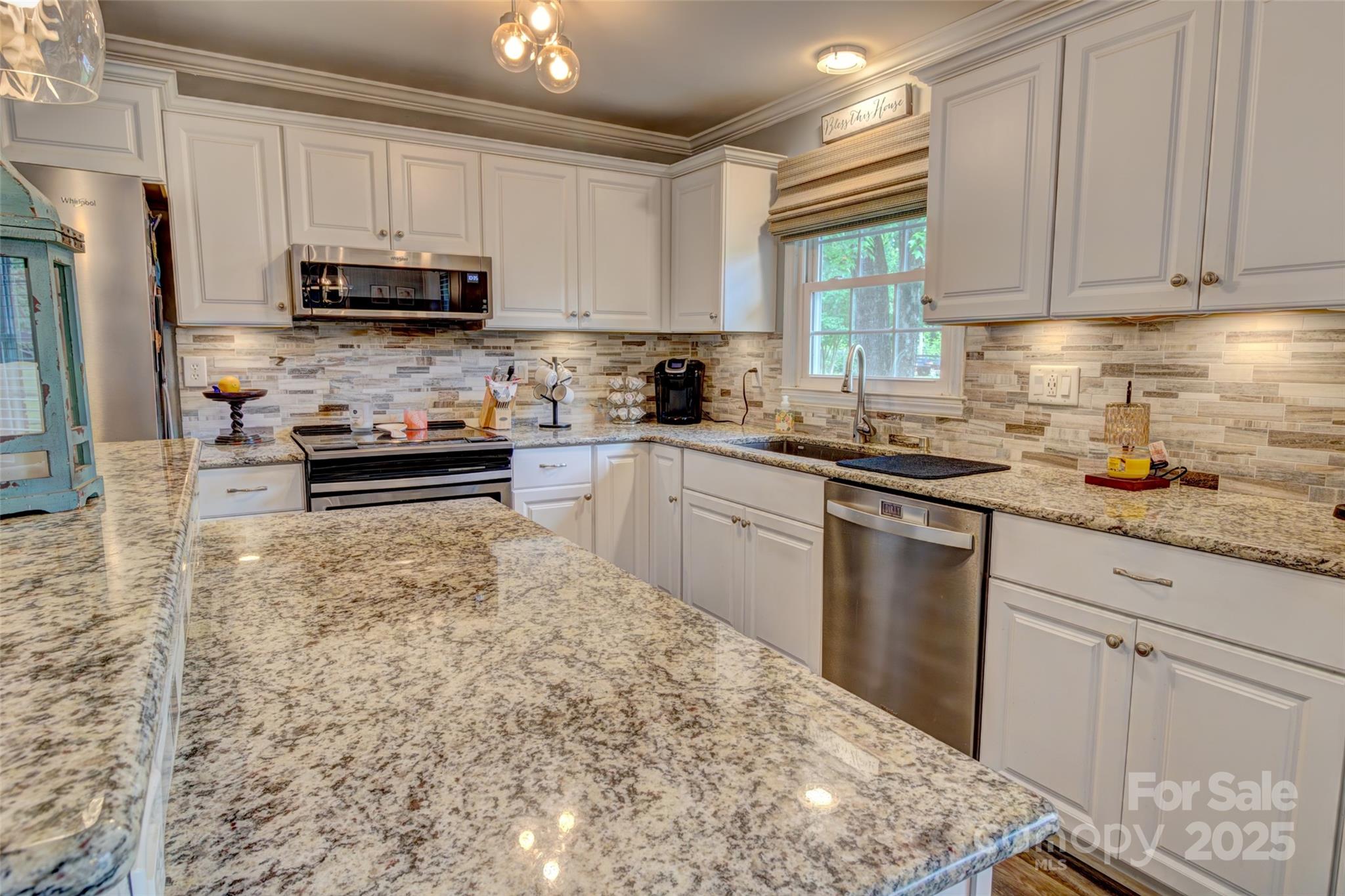 800 Sunset Road Cherryville, NC 28021 - Photo 7 of 20 a kitchen with stainless steel appliances granite countertop a sink stove and microwave
