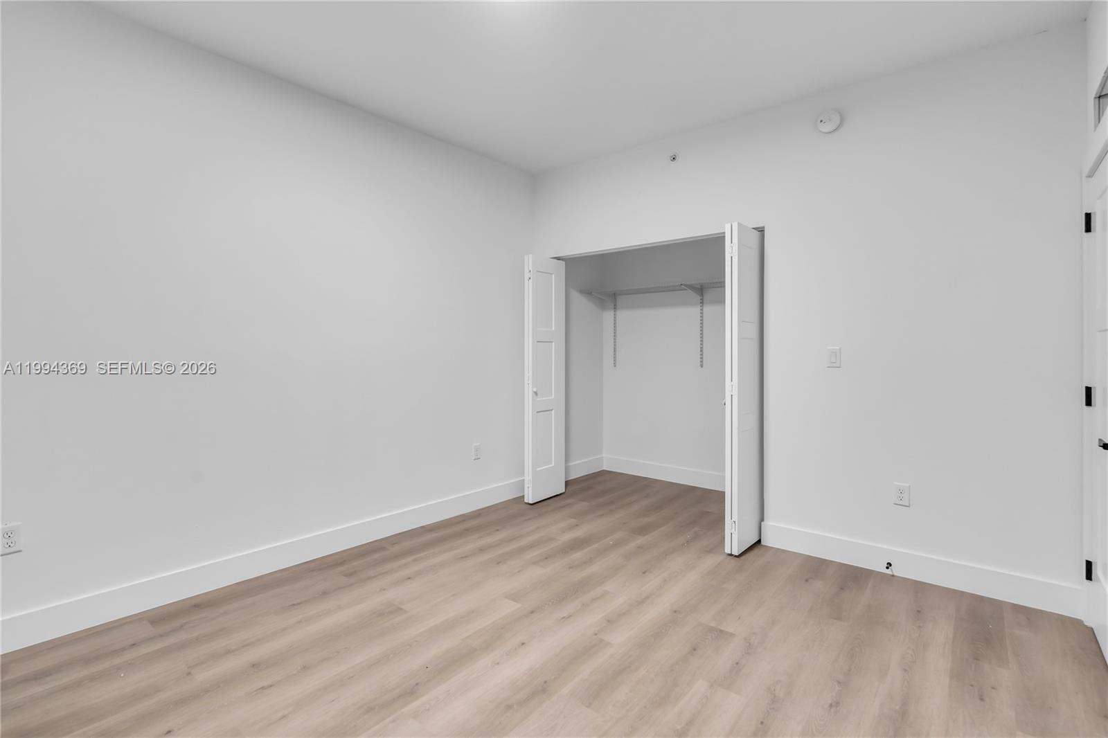 3728 Northwest 19th Avenue, Unit 101 Miami, FL 33142 - Photo 9 of 11 a view of an empty room