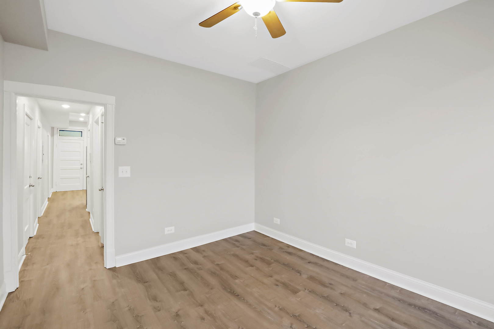 2626 North Ridgeway Avenue, Unit 1 Chicago, IL 60647 - Photo 8 of 16 a view of an empty room with wooden floor