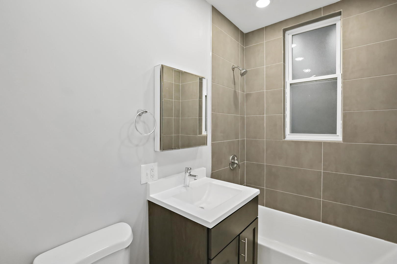 2626 North Ridgeway Avenue, Unit 1 Chicago, IL 60647 - Photo 9 of 16 a bathroom with a sink toilet and shower